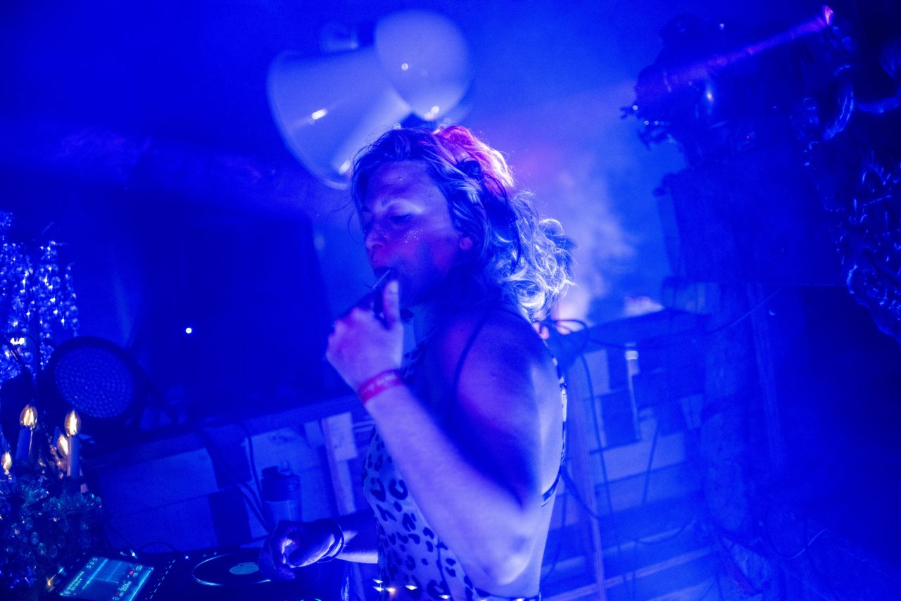 Daniela at the decks at CAMP in deep blue light