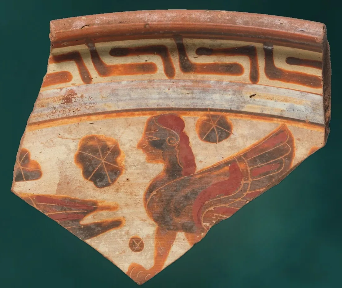 A painted plate fragment showing a siren with spread wings
